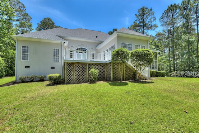 327 Peter Carnes Dr, North Augusta, SC 29860 - rear view of property featuring stairway, a lawn, stucco siding, a shingled roof, and a wooden deck