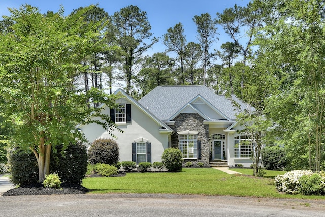 327 Peter Carnes Dr, North Augusta, SC 29860 - view of front of home featuring stone siding, a front lawn, and stucco siding