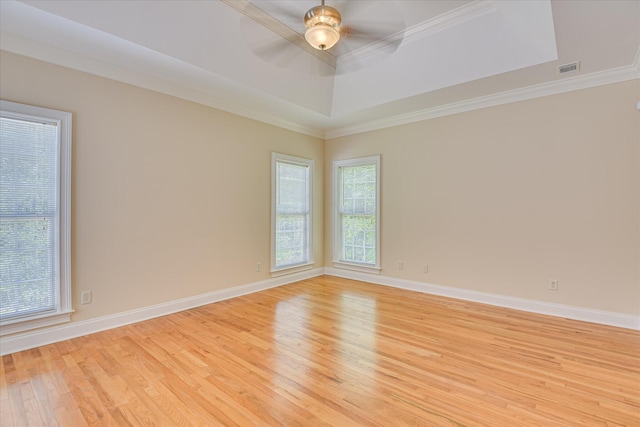 327 Peter Carnes Dr, North Augusta, SC 29860 - spare room featuring light wood finished floors, a raised ceiling, ornamental molding, a ceiling fan, and baseboards