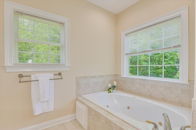 327 Peter Carnes Dr, North Augusta, SC 29860 - bathroom with plenty of natural light, a tub with jets, tile patterned floors, and baseboards