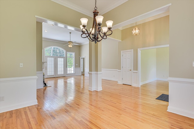 327 Peter Carnes Dr, North Augusta, SC 29860 - spare room featuring ornamental molding, a chandelier, a ceiling fan, light wood-type flooring, and ornate columns