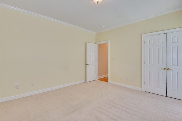 327 Peter Carnes Dr, North Augusta, SC 29860 - unfurnished bedroom featuring crown molding, carpet floors, baseboards, and a closet