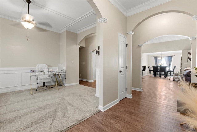 office space with hardwood / wood-style flooring, ceiling fan, ornate columns, and ornamental molding