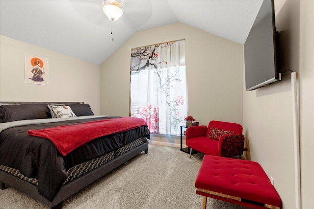 bedroom with carpet floors, vaulted ceiling, and ceiling fan