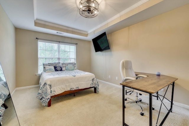 carpeted bedroom with ornamental molding, a tray ceiling, visible vents, and baseboards