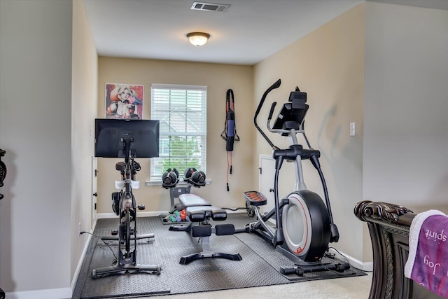 exercise room featuring visible vents, carpet floors, and baseboards