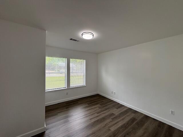 641 Ellington Ave, Thomson, GA 30824 - unfurnished room featuring dark wood-type flooring and baseboards