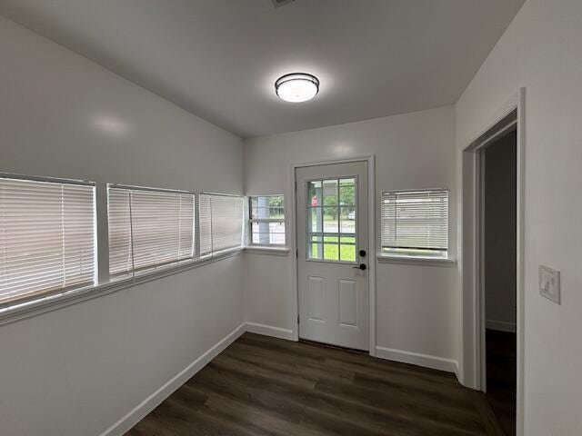 641 Ellington Ave, Thomson, GA 30824 - doorway to outside with dark wood-type flooring and baseboards