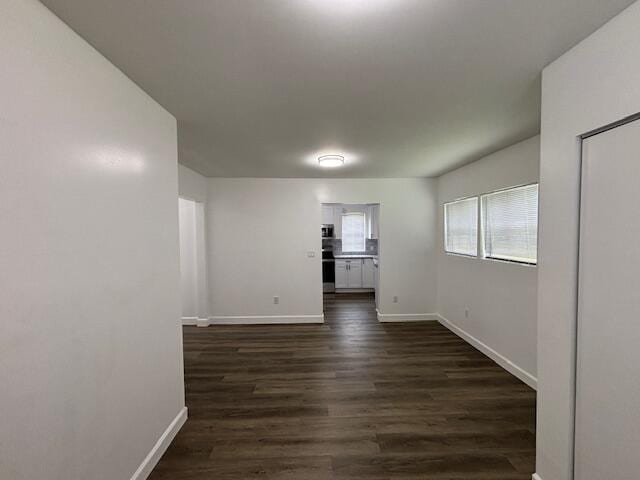 641 Ellington Ave, Thomson, GA 30824 - spare room with baseboards and dark wood-style floors