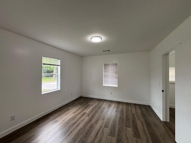 641 Ellington Ave, Thomson, GA 30824 - spare room with dark wood finished floors and baseboards