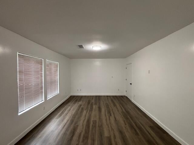 641 Ellington Ave, Thomson, GA 30824 - spare room featuring dark wood finished floors and baseboards