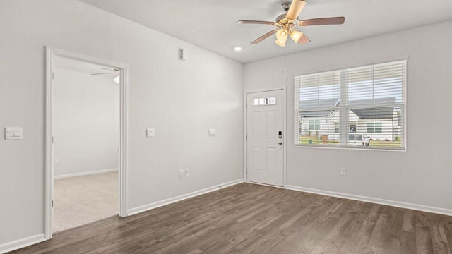 entrance foyer featuring dark hardwood / wood-style flooring and ceiling fan