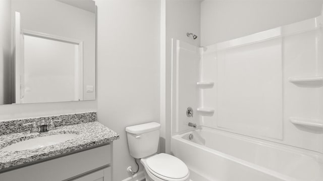 full bathroom with vanity, bathing tub / shower combination, and toilet