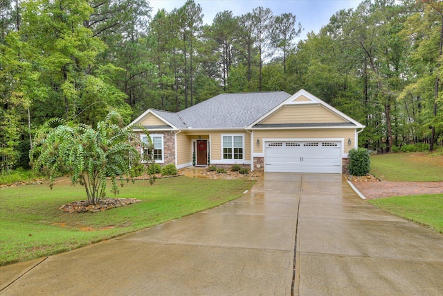 view of front of home with a garage and a front lawn