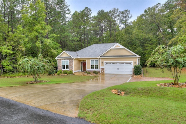 view of front of house with a garage and a front yard