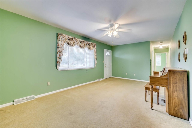 carpeted empty room with ceiling fan