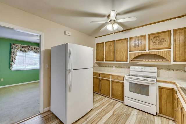 kitchen with extractor fan, tasteful backsplash, ceiling fan, white appliances, and light hardwood / wood-style floors