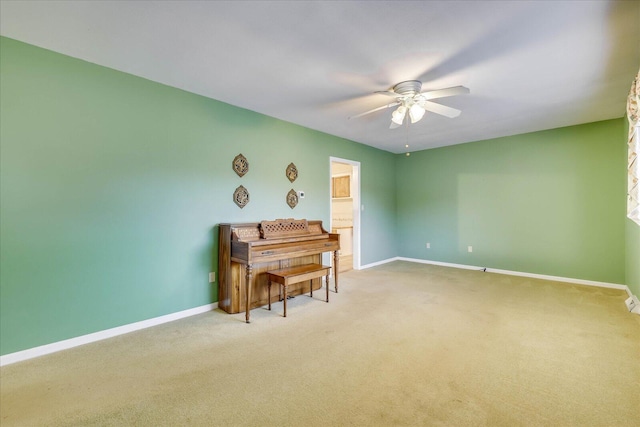 misc room with carpet floors and ceiling fan