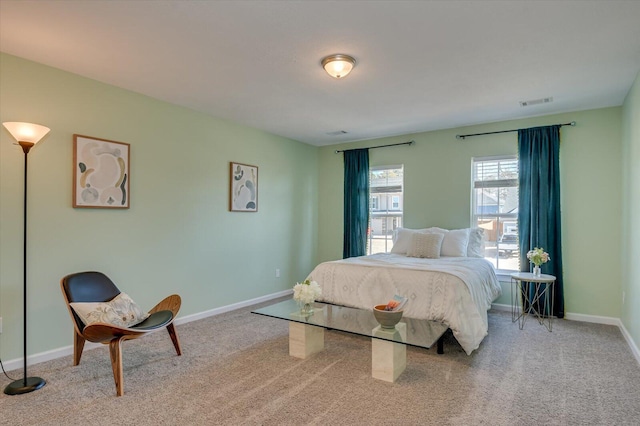 bedroom featuring light colored carpet