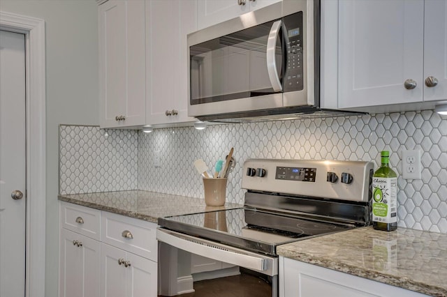 kitchen featuring white cabinetry and appliances with stainless steel finishes