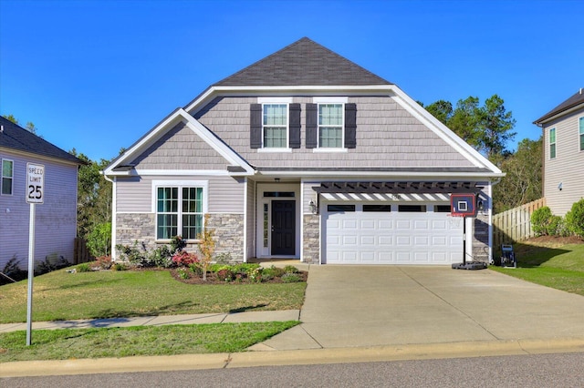 craftsman-style house featuring a garage and a front lawn