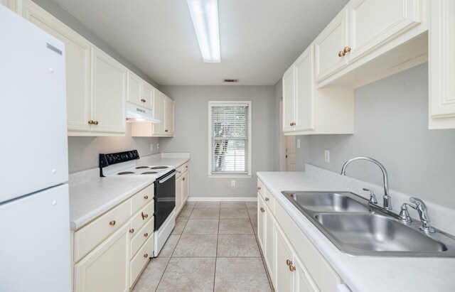 kitchen featuring sink, white cabinets, white appliances, and light tile patterned floors