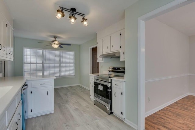 kitchen featuring white cabinetry, ceiling fan, appliances with stainless steel finishes, and light hardwood / wood-style floors