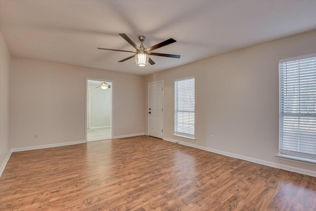 unfurnished room with light hardwood / wood-style flooring and ceiling fan