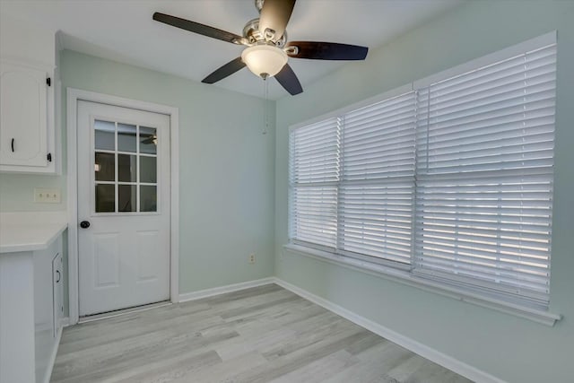 interior space featuring light hardwood / wood-style floors and ceiling fan