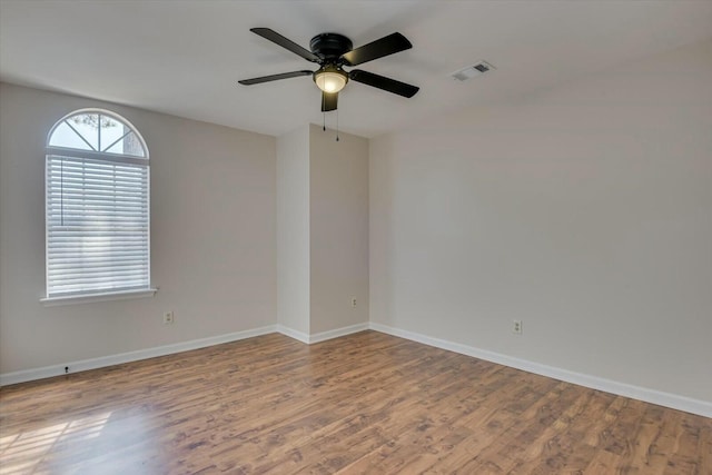 empty room featuring ceiling fan and wood-type flooring