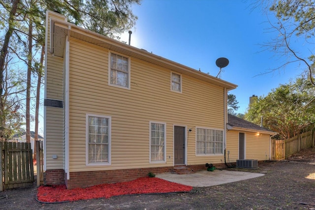 back of house with a patio area and central air condition unit