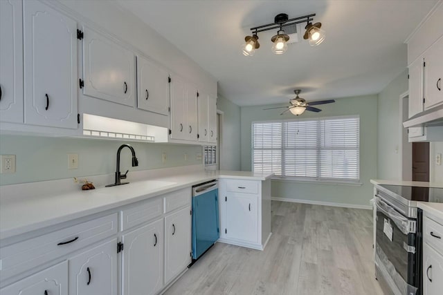 kitchen with white cabinetry, light hardwood / wood-style flooring, ceiling fan, and appliances with stainless steel finishes