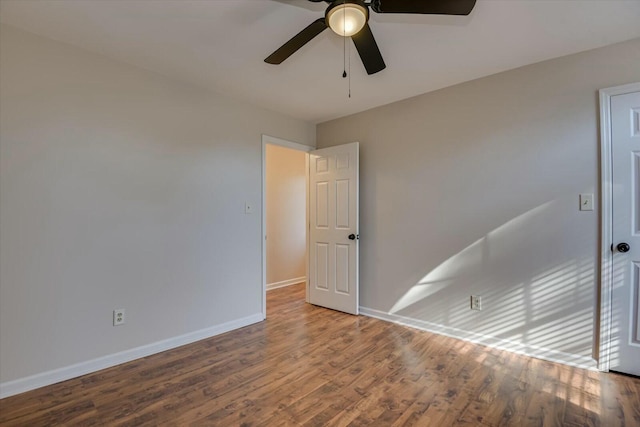 unfurnished room featuring ceiling fan and hardwood / wood-style floors