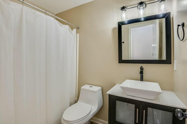 bathroom with vanity, a shower with curtain, and toilet