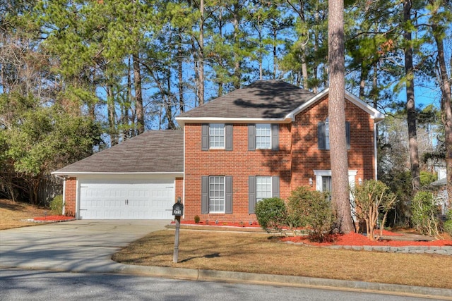 colonial-style house with a garage and a front yard