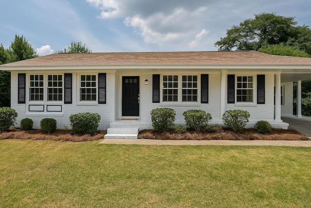 2079 Hillsinger Rd, Augusta, GA 30904 - single story home with brick siding, a front yard, an attached carport, and covered porch