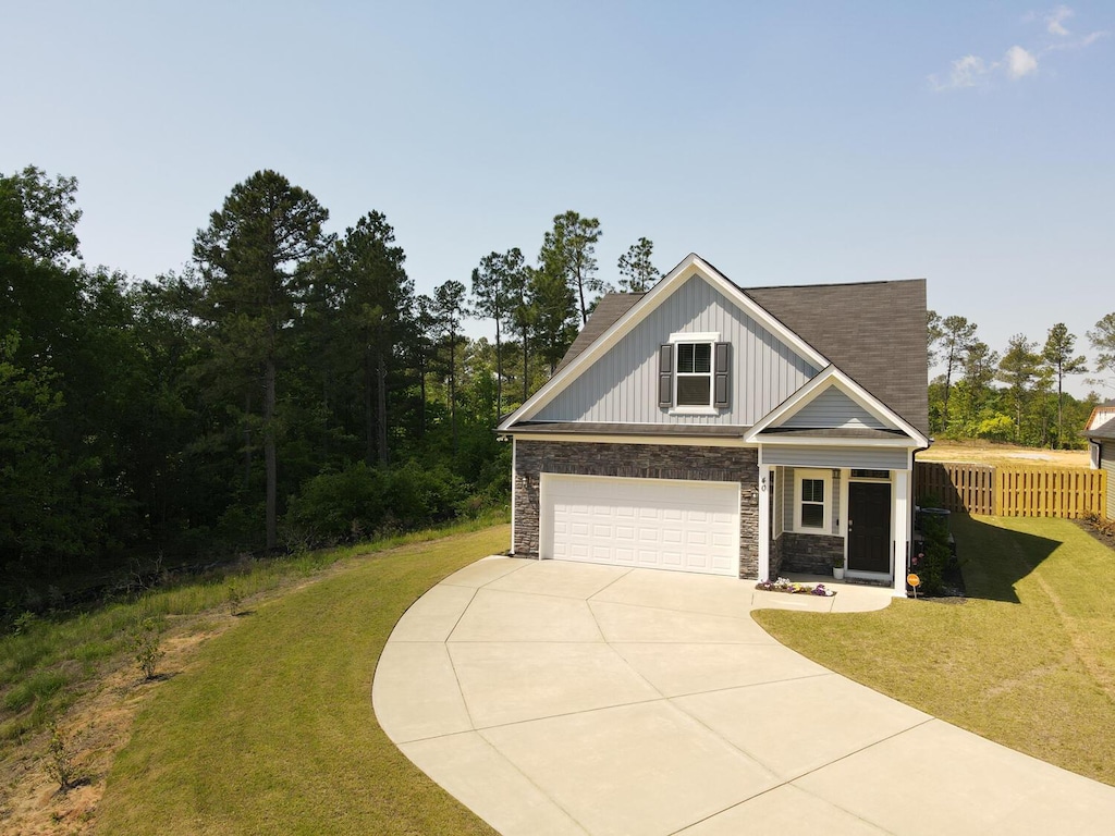 view of front facade with a garage and a front yard