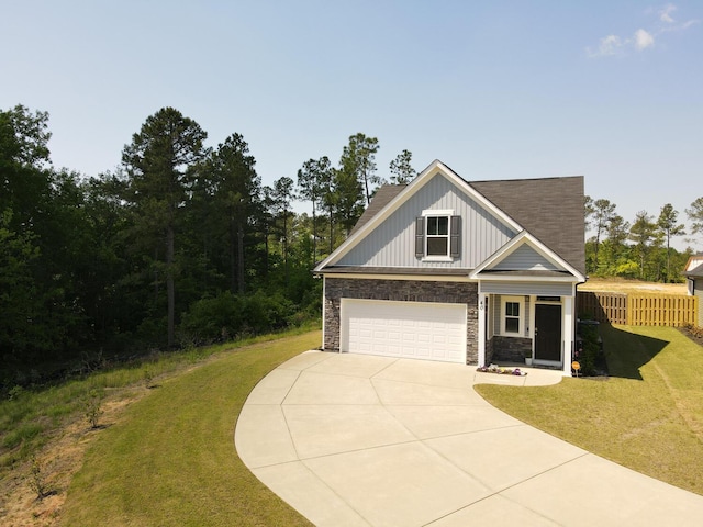 view of front facade with a garage and a front yard