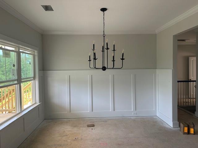 8144 Crossbow Lndg, Graniteville, SC 29829 - unfurnished dining area featuring a decorative wall, a chandelier, crown molding, and wainscoting