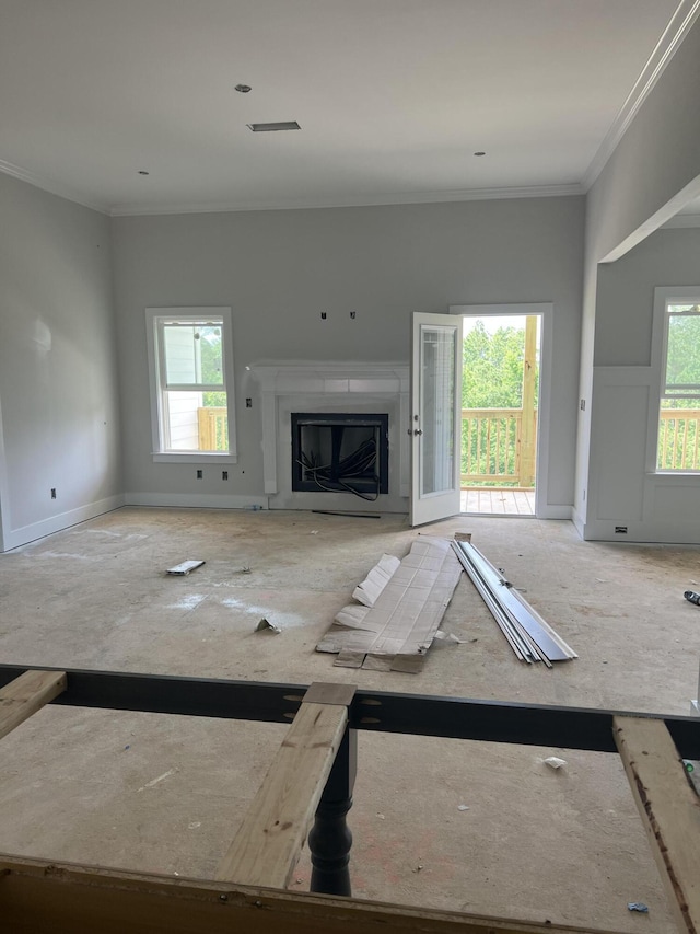 8144 Crossbow Lndg, Graniteville, SC 29829 - unfurnished living room featuring plenty of natural light, crown molding, and a glass covered fireplace