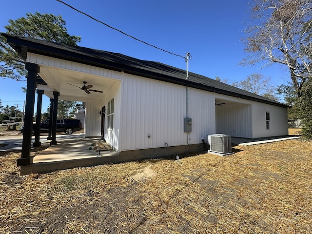 view of side of home featuring central air condition unit and ceiling fan