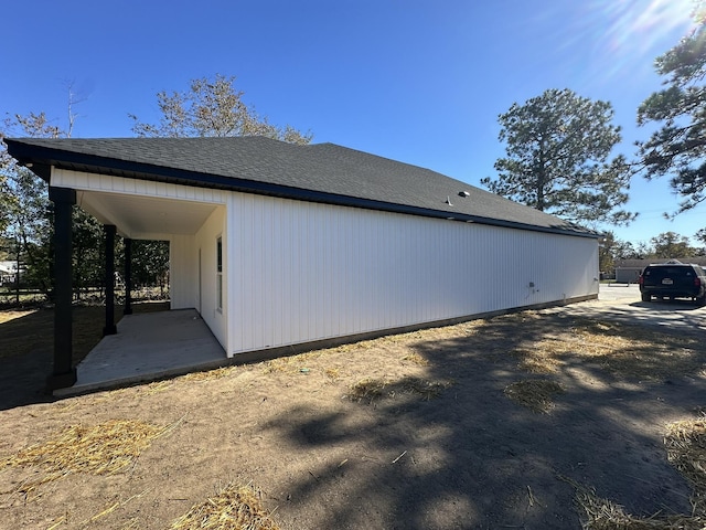 view of side of property with a patio