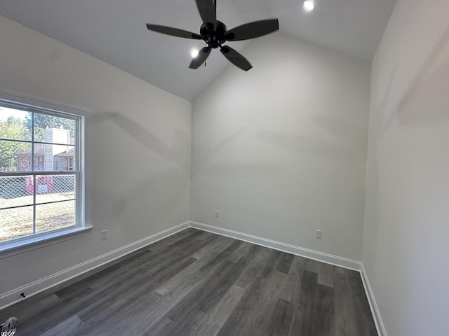 unfurnished room with dark wood-type flooring, vaulted ceiling, ceiling fan, and a healthy amount of sunlight