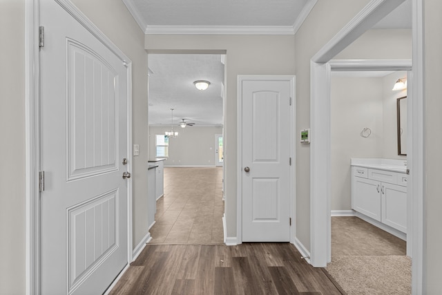 1006 Rosendale Dr, Hephzibah, GA 30815 - hallway featuring dark wood-style floors and crown molding
