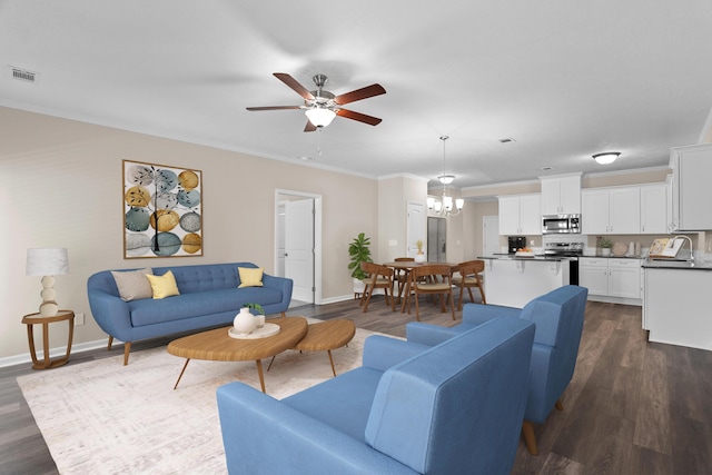 1006 Rosendale Dr, Hephzibah, GA 30815 - living area featuring dark wood finished floors, ornamental molding, and ceiling fan