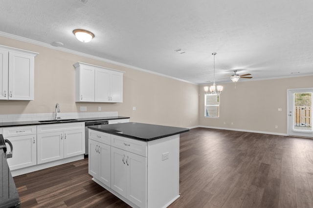 1006 Rosendale Dr, Hephzibah, GA 30815 - kitchen with dishwasher, dark countertops, dark wood-type flooring, white cabinets, and a kitchen island