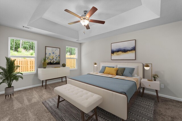 1006 Rosendale Dr, Hephzibah, GA 30815 - carpeted bedroom with a raised ceiling and a ceiling fan