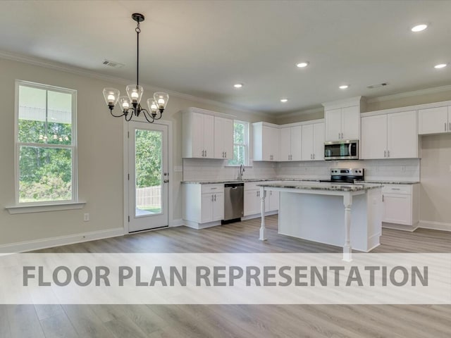 807 Lillian Park Dr Unit Lp2, Grovetown, GA 30813 - kitchen with stainless steel appliances, ornamental molding, white cabinetry, decorative backsplash, and light wood-style flooring