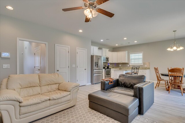 260 Claudia Dr, Grovetown, GA 30813 - living room with light wood-type flooring, a ceiling fan, a chandelier, recessed lighting, and baseboards