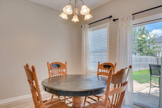 260 Claudia Dr, Grovetown, GA 30813 - dining room with a chandelier, light wood-style flooring, and baseboards